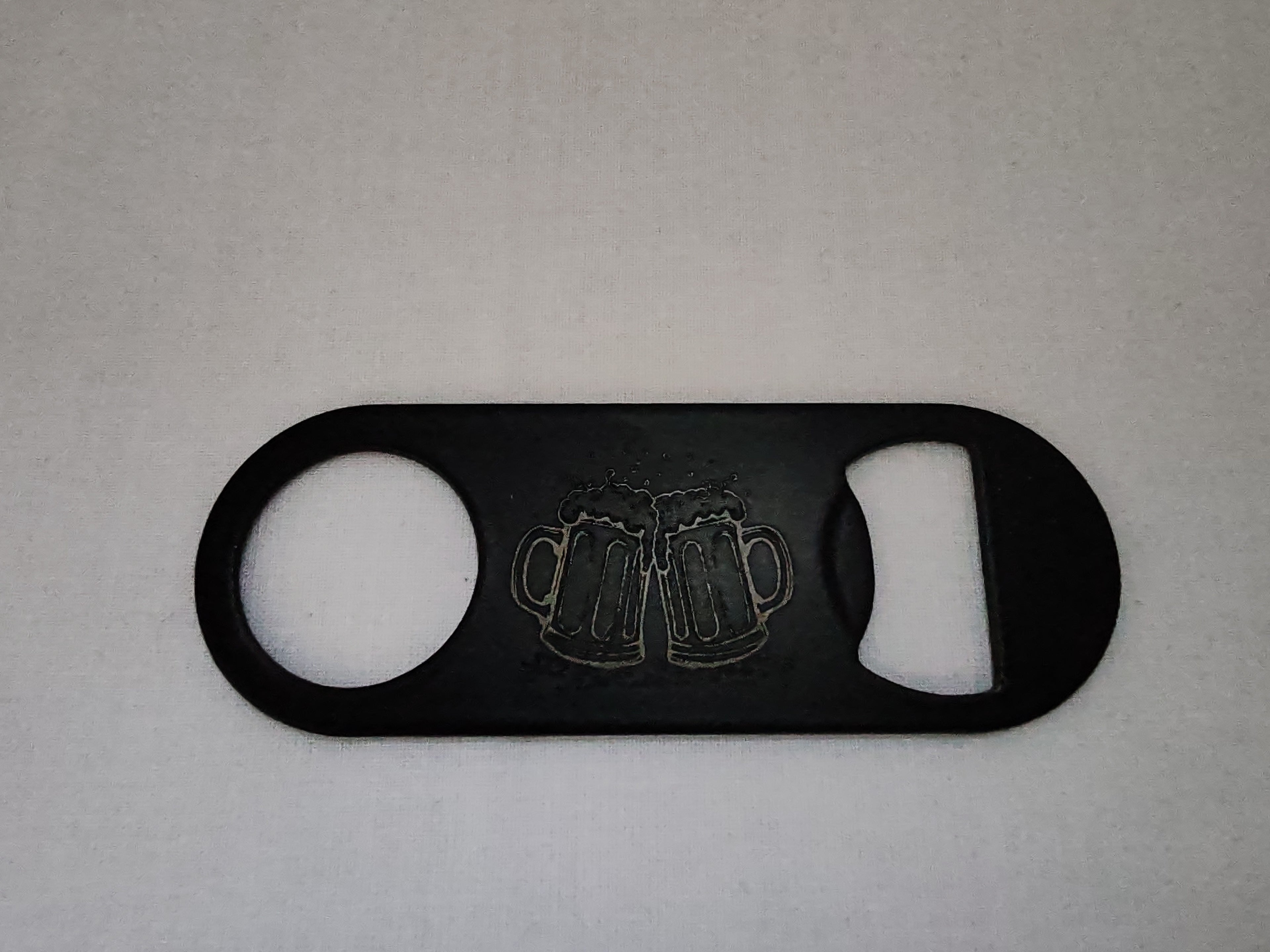 Décapsuleur métal motif tchin